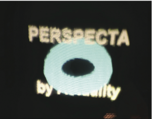 A frontal view of a 3D logo. The text reads "Perspecta by Actuality". Notice the lower text "by Actuality" is mostly occluded by the torus.